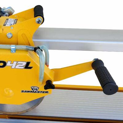 Dual handle system gives user a choice of pulling or plunging the cutting head when cutting a work piece.